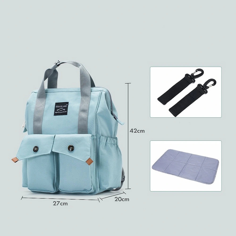 The Ellie & Luke Multifunctional Diaper Bag by Ellie And Luke is a light blue backpack with gray and black straps, two front pockets, and a folded gray changing pad. Measuring 42x27x20cm, it features insulated bottle holders for unisex use.