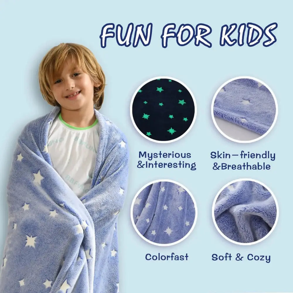 A child wrapped in an Alaya Junior Glow in the Dark Blanket, adorned with blue and star patterns, smiles next to the text reading "FUN FOR KIDS." Four circular insets highlight the blanket’s features: mysterious & interesting (glow-in-the-dark stars), skin-friendly & breathable, colorfast, and soft & cozy.