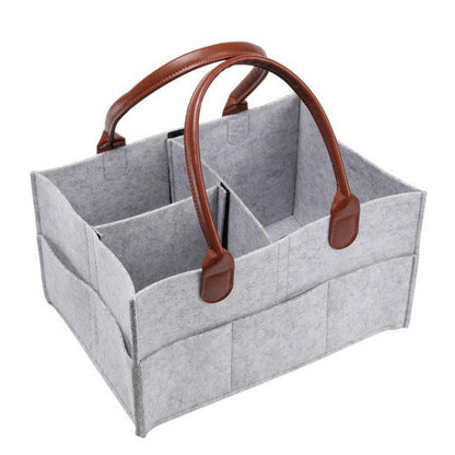 Gray storage caddy with brown handles on a white background