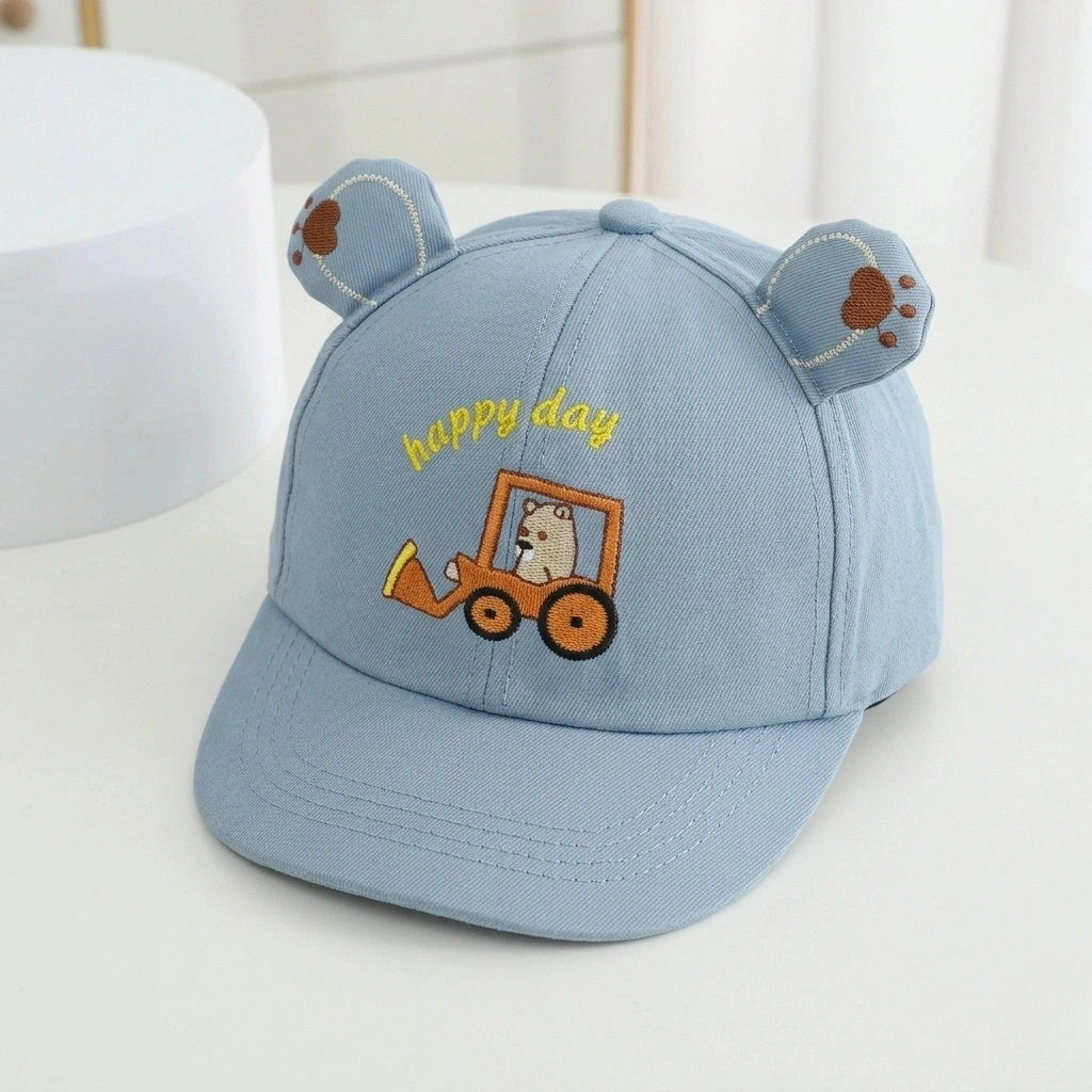 Blue children's cap with bear ears and 'happy day' text on a white background