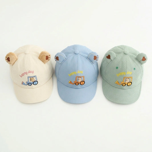 Three children's caps with bear ears and 'Happy Day' embroidery on a white background