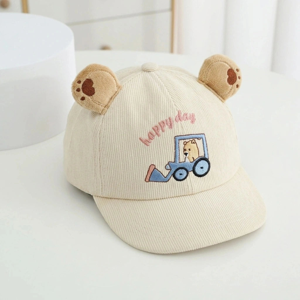 Beige cap with bear ears and 'Happy Day' embroidery on a white surface