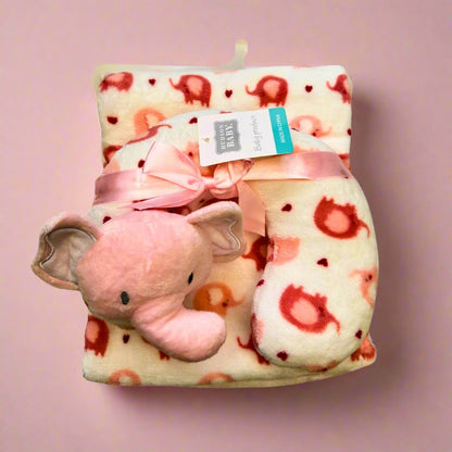 Baby blanket with elephant toy and tag on a white background