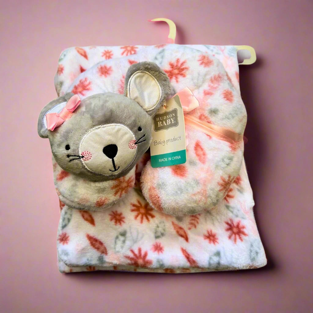 Floral-patterned baby blanket with a plush mouse toy on a white background