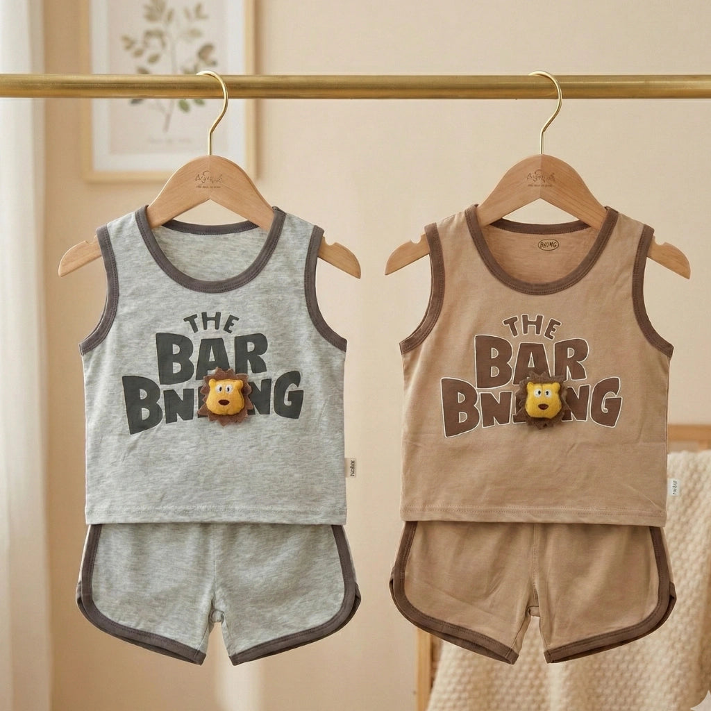 Two children's tank tops and shorts sets hanging on a rack with 'The Bar Buing' text.