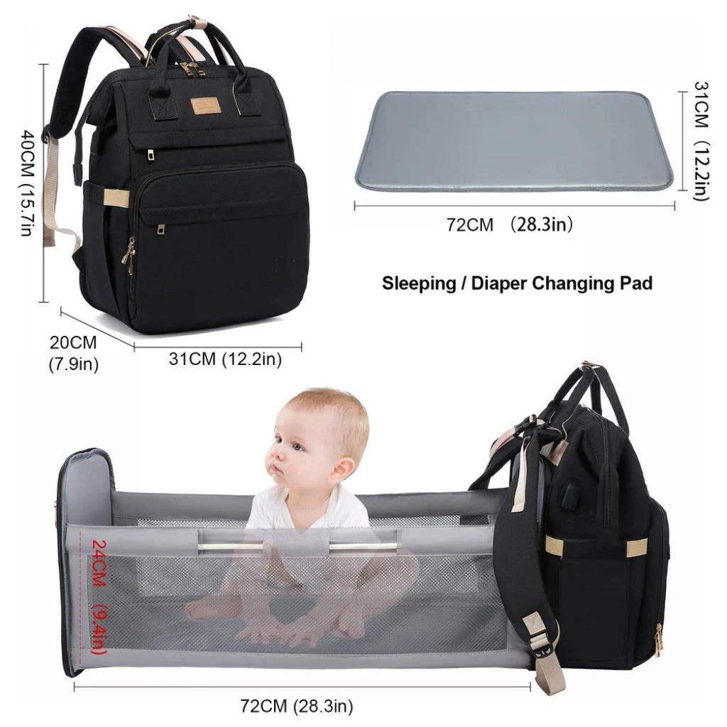 Black backpack with dimensions, sleeping/diaper changing pad, and baby in a portable crib.