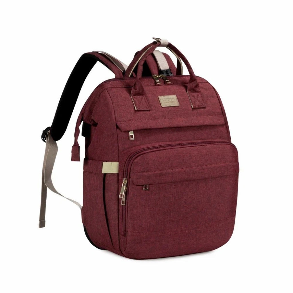 Maroon backpack with multiple pockets and straps on a white background