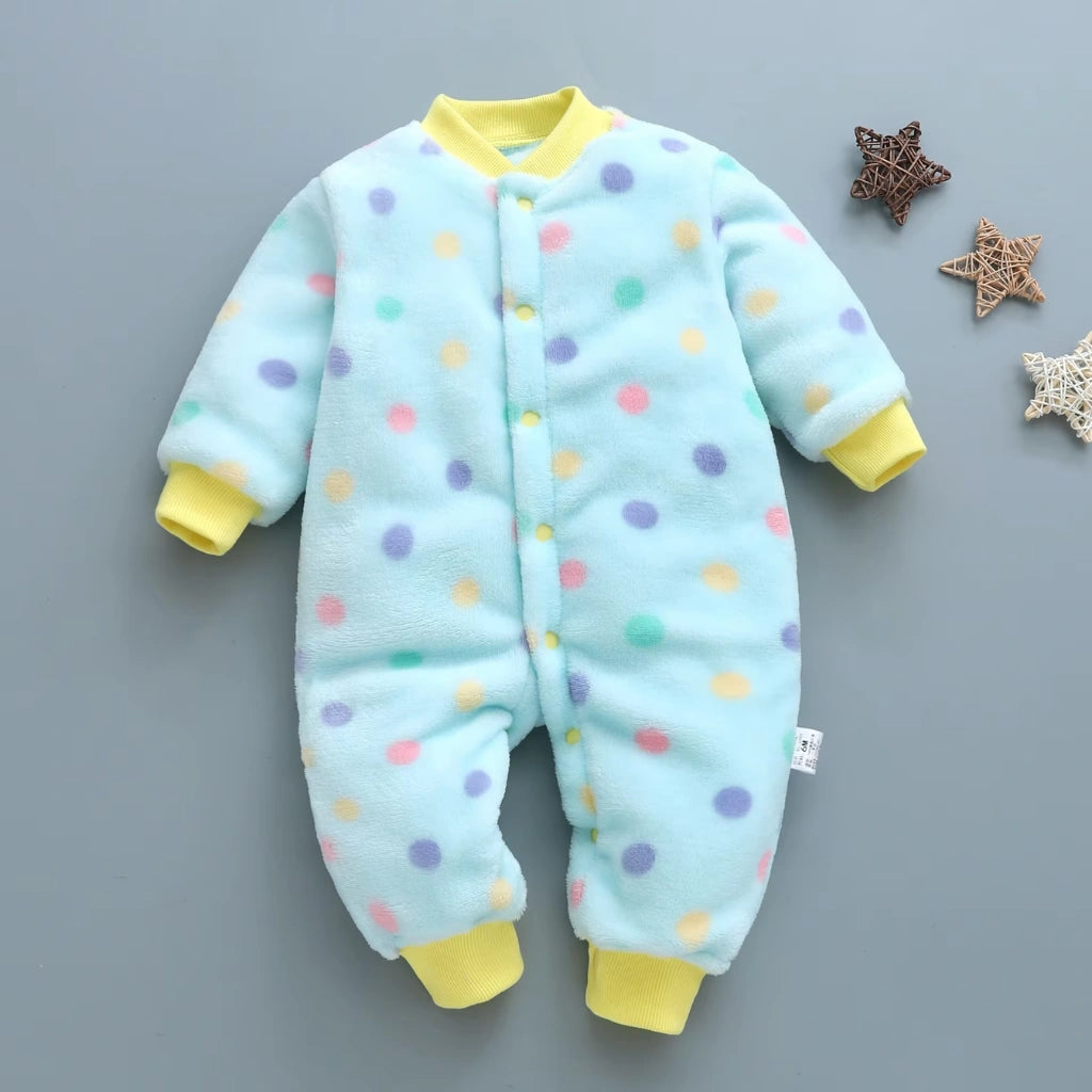 Baby onesie with colorful polka dots on a gray background