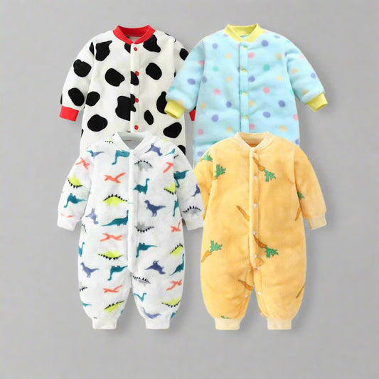 Four colorful baby onesies with different patterns on a white background