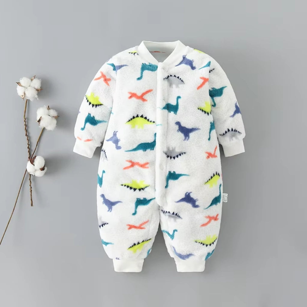 Baby onesie with colorful dinosaur pattern on a gray background