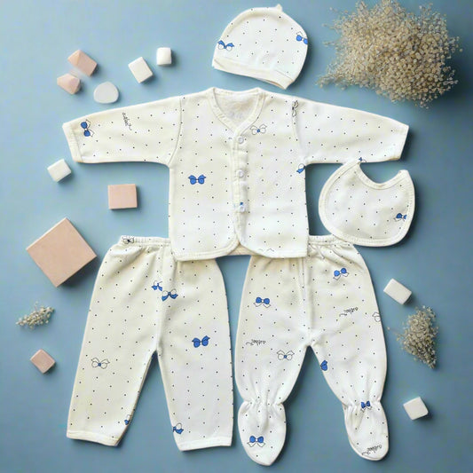 Baby clothing set with onesie, pants, bib, and hat on a white background