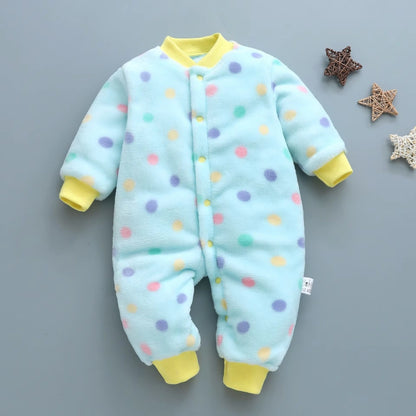 Baby onesie with colorful polka dots on a gray background