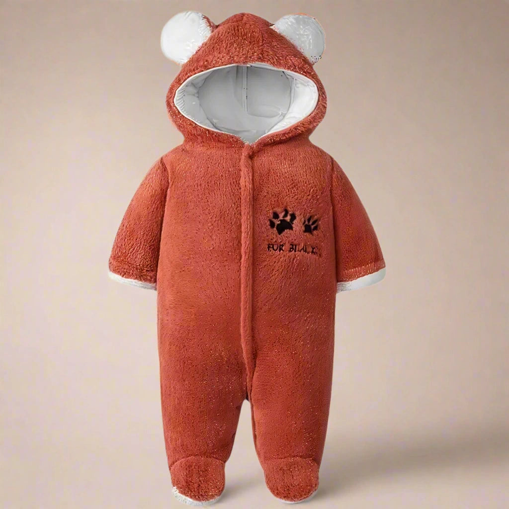 Rust baby onesie with bear ears and paw print design on a white background