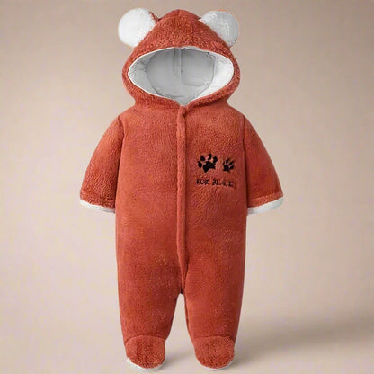 Rust baby onesie with bear ears and paw print design on a white background