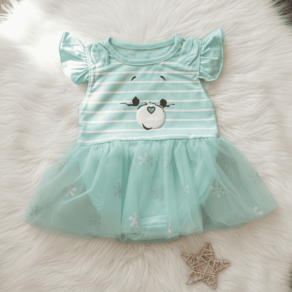 Mint green dress with cartoon face on a fluffy white surface