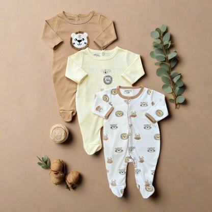 Three baby onesies with lion designs on a white background