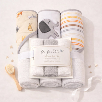 Baby bath set with towels and washcloths on a light background