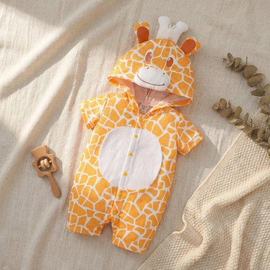 Baby onesie with giraffe pattern on a beige fabric background