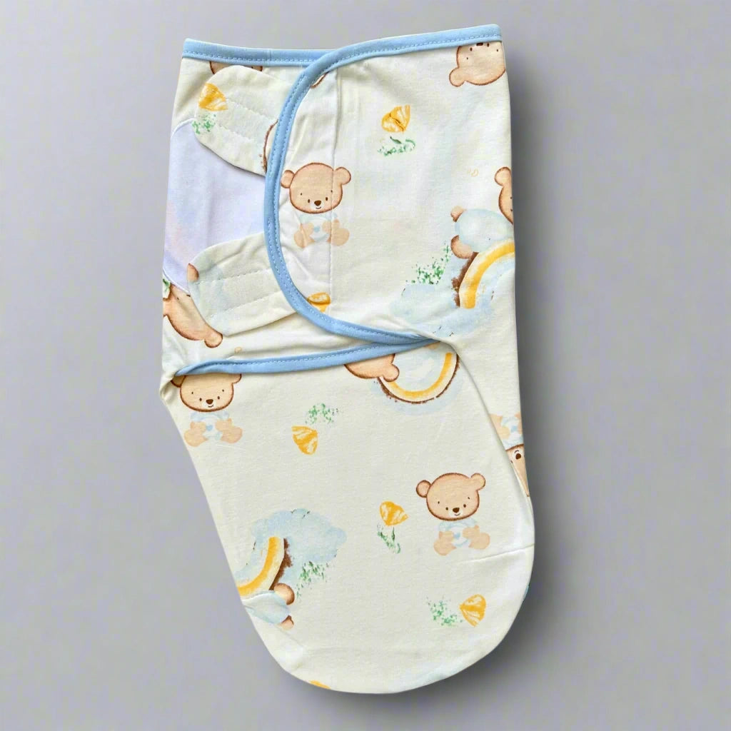 Baby swaddle with teddy bear pattern on a white background