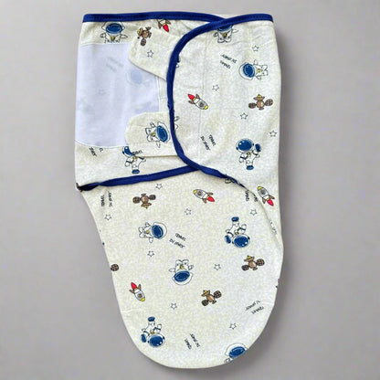Baby swaddle with space-themed design on a white background
