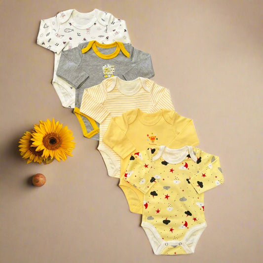 Set of baby bodysuits in various colors and patterns on a white background
