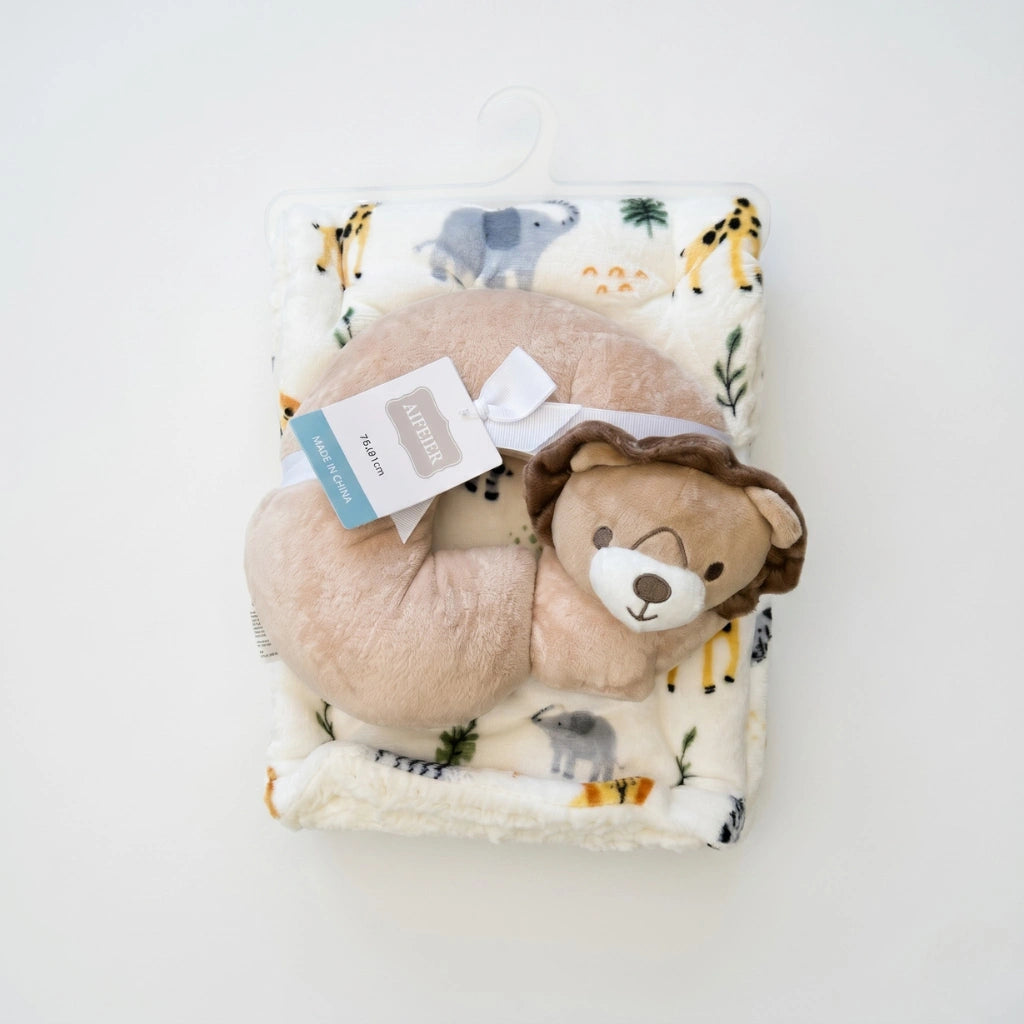 Plush toy bear on a blanket with animal prints on a white background