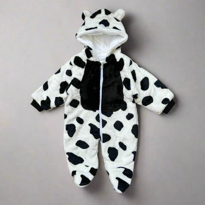 Black and white cow-themed baby onesie on a white background