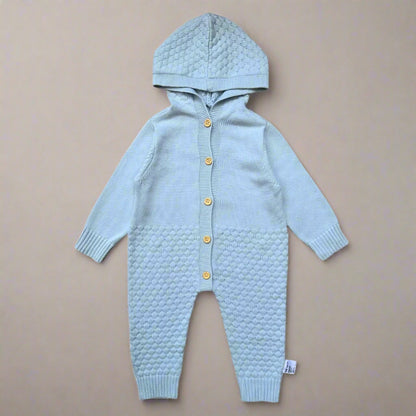 Light blue knitted baby romper with a hood on a white background