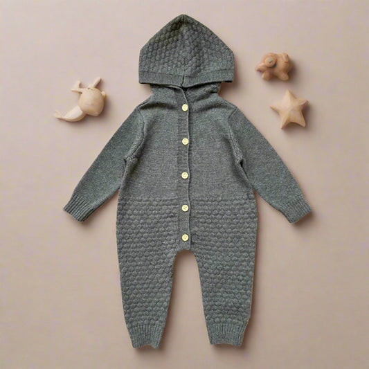 Gray knitted baby onesie with buttons on a white background