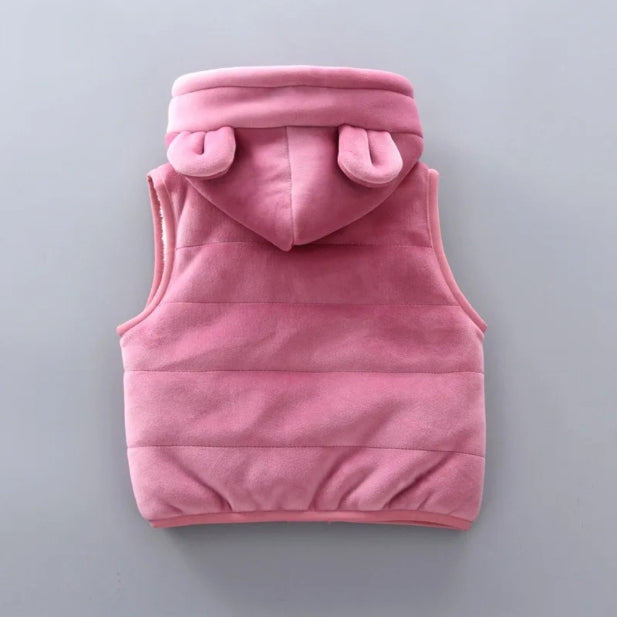 Introducing the Alaya Junior Warm Pink Furry Bear Fleece 3-Piece Set for Baby Girls: a charming pink sleeveless vest with a hood adorned with small bear ears, crafted from ultra-soft fleece. The plush vest is beautifully displayed from the back against a solid gray background.