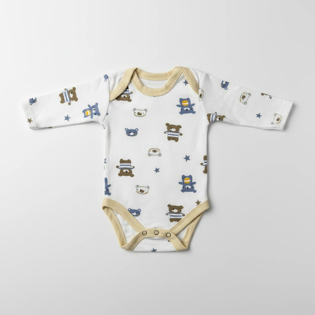 A long-sleeve baby bodysuit with a white base, beige trim, and an all-over print of cartoon teddy bears and stars in blue, brown, and beige, laid flat on a light gray background.