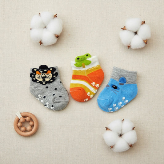 Three pairs of colorful baby socks on a white background with 'Carter's' branding.