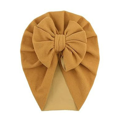 The PatPat Baby / Toddler Solid Bowknot Hat by Alaya Junior features a charming tan fabric design with a large bow on the front. The material is soft and elegantly pleated around the bow, standing out beautifully against a white background.