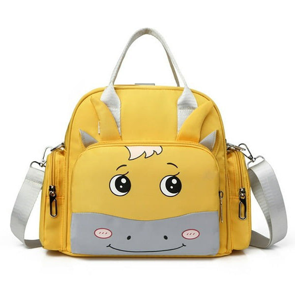 Discover the adorable Alaya Junior Luxury Multi-function Mother Backpack, a fashionable diaper bag in vibrant yellow with a cartoon animal face on the front pocket. It features big eyes, a smiling mouth, two gray handles, and a detachable shoulder strap with side zipper pockets, combining style and functionality.