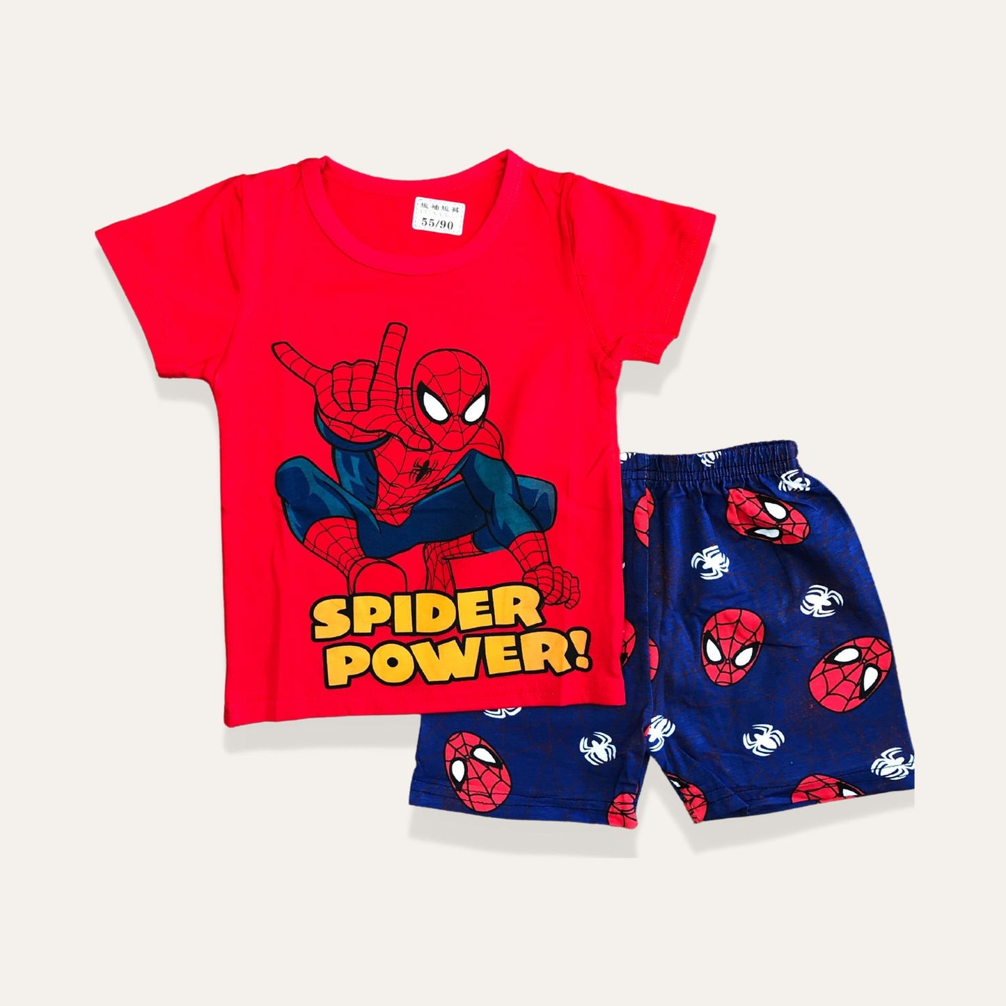 Introducing the Spider-Man Graphic Tee and Casual Short Set for Boys by Alaya Junior – a Marvel 2-Pack that's ideal for infant clothing in Pakistan. This set features a red T-shirt with an eye-catching image of Spider-Man and the text "Spider Power!" below. The matching blue shorts are decorated with a pattern of Spider-Man's face and white spider icons, making it perfect for your little superhero.