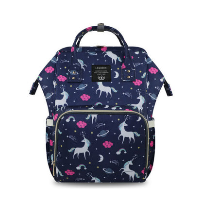 The LEQUEEN Unicorn Mommy Diaper Bag by Alaya Junior is a navy blue backpack decorated with unicorns, stars, moons, planets, and pink clouds. It includes a front zippered pocket, side pockets, and handles on top for easy carrying. Ideal for storing infant clothing from Pakistan or newborn baby essentials. The brand label "L.EQUEEN" is displayed near the top.