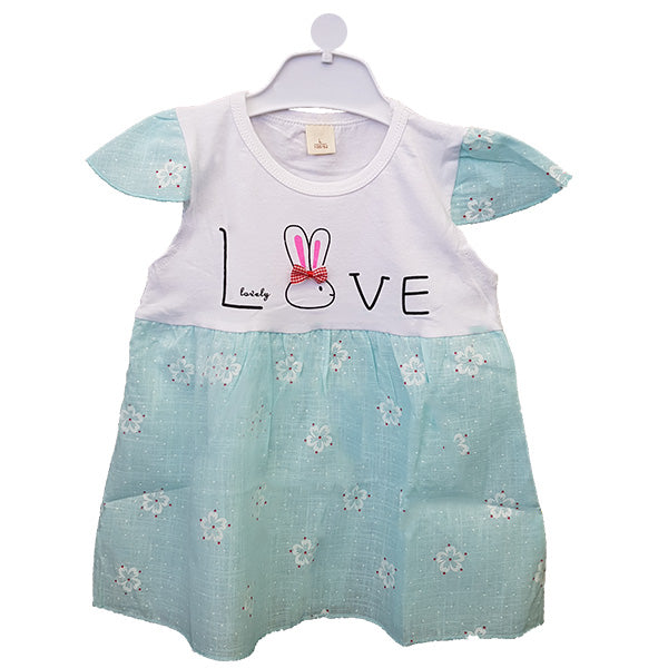 Introducing the Love Bunny Summer Frock by Alaya Junior, an adorable baby dress perfect for newborns. This charming piece features a white top adorned with a "Love" design, accompanied by a bunny and bow, with "Lovely" written beneath it. The light blue bottom half showcases a floral pattern that matches the short sleeves. Displayed elegantly on a white hanger, this delightful infant clothing is made in Pakistan.